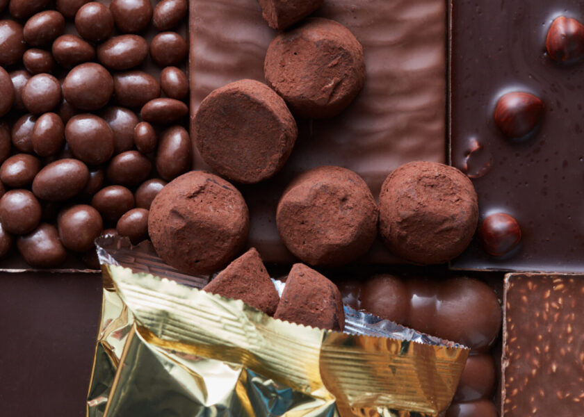 Chocolate Candies Poured On The Background