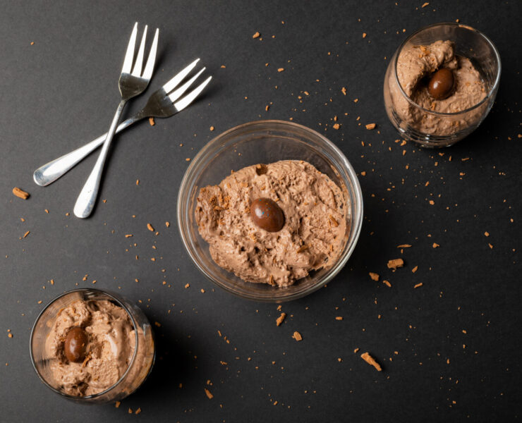 High Angle View Of Chocolate Mousse With Coated Nuts, Shredded Chocolate And Forks On Table. Unaltered, Dessert, Sweet Food, Candy And Chocolate Indulgence.