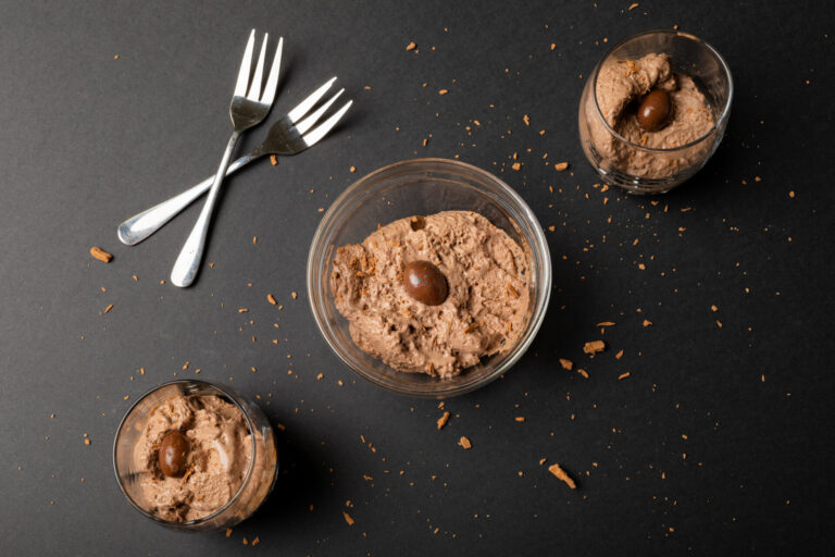 High Angle View Of Chocolate Mousse With Coated Nuts, Shredded Chocolate And Forks On Table. Unaltered, Dessert, Sweet Food, Candy And Chocolate Indulgence.